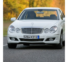 Бампер передний в цвет кузова Mercedes E-Class W211 (2006-2009) рестайлинг с омывателем и парктроником